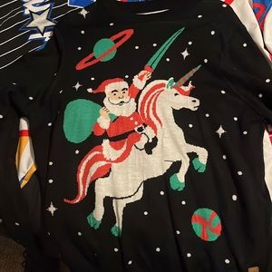 Tipseyelfs soft Christmas sweater with Santa on a Univorn